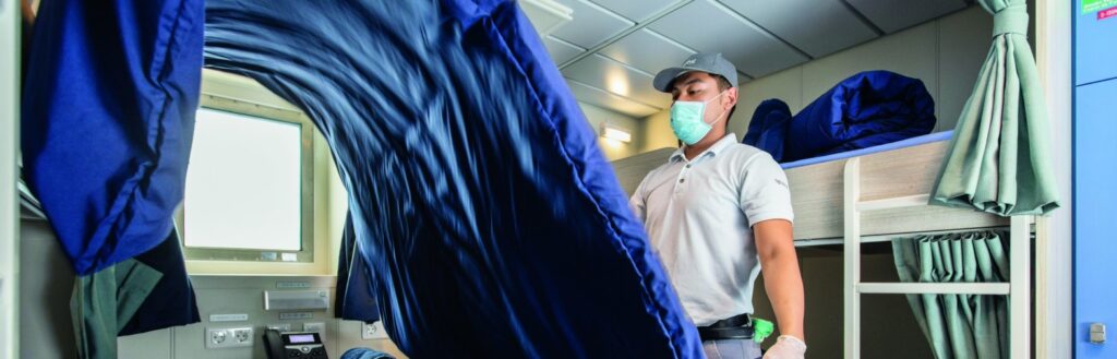 Employee makes bed, rail service Newrest