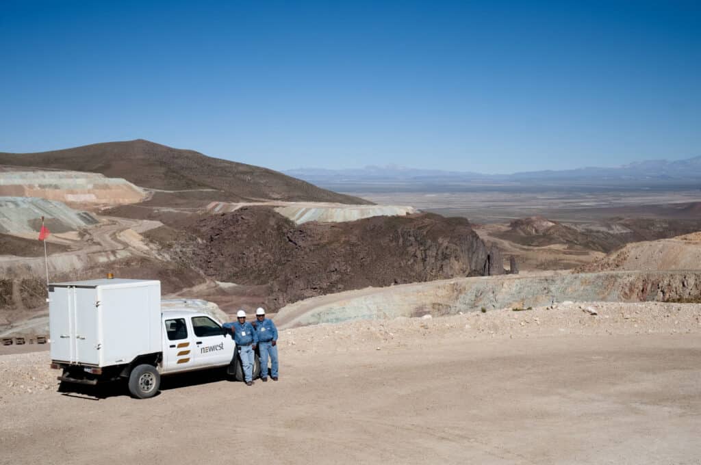 Newrest employees in front of a mining industry in Latin America